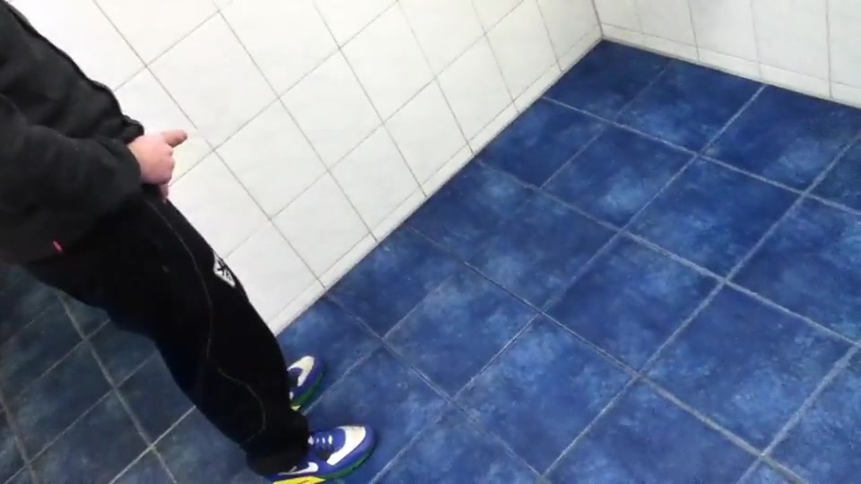 Three guys trashing a bathroom floor