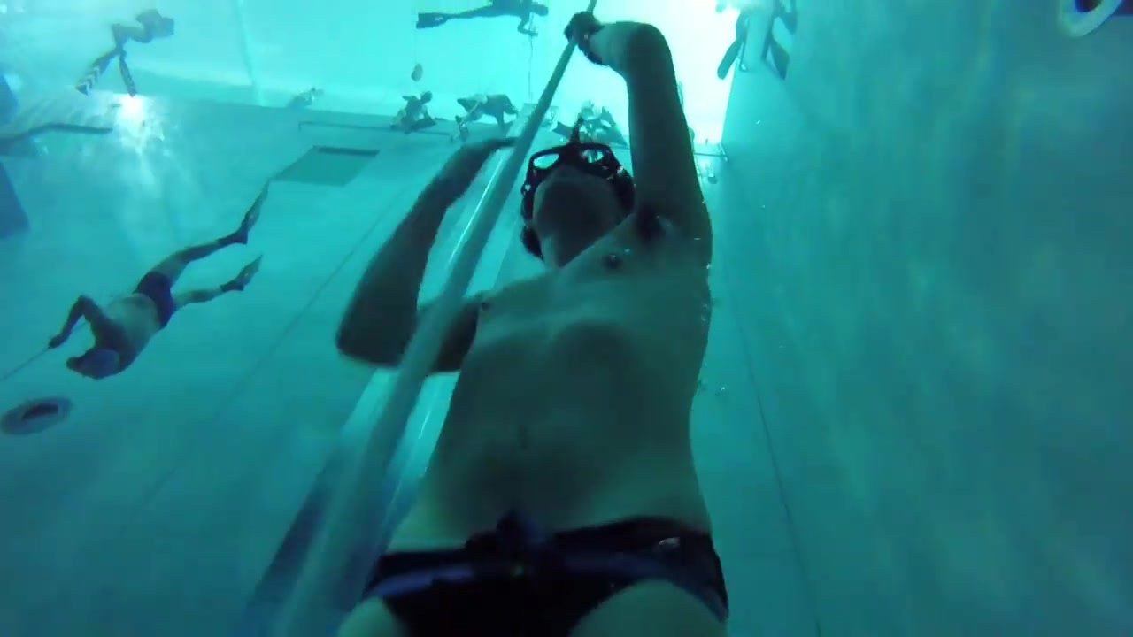Freediving underwater in black speedos - video 2