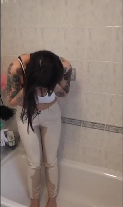 tattoo girl wetting in bathtub