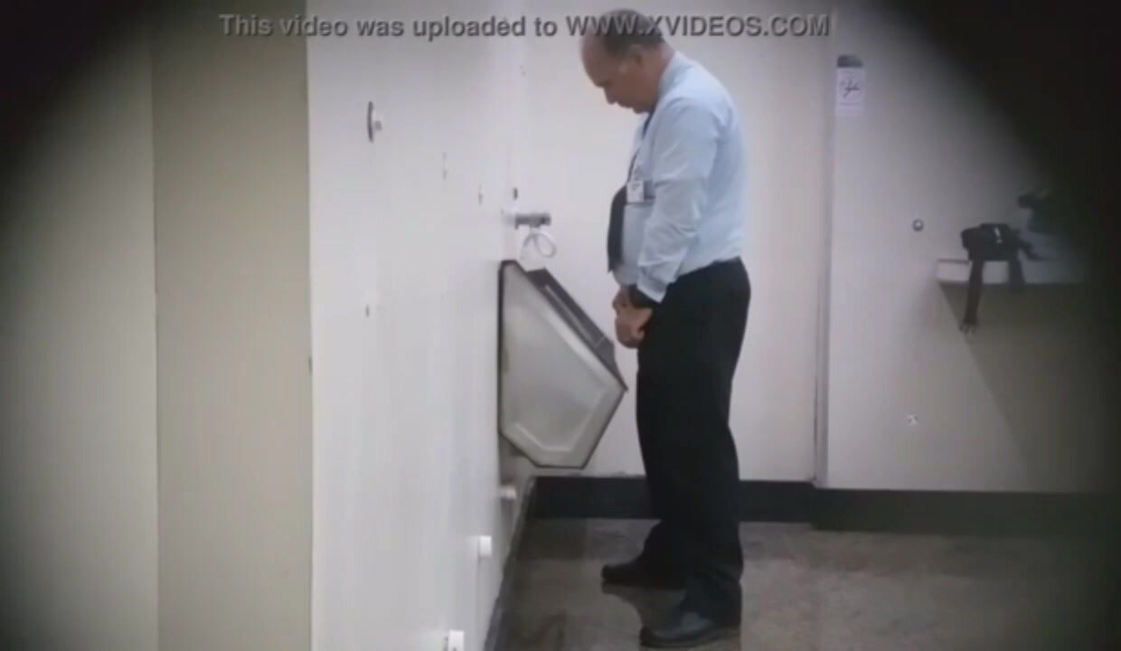 Old man taking a leak