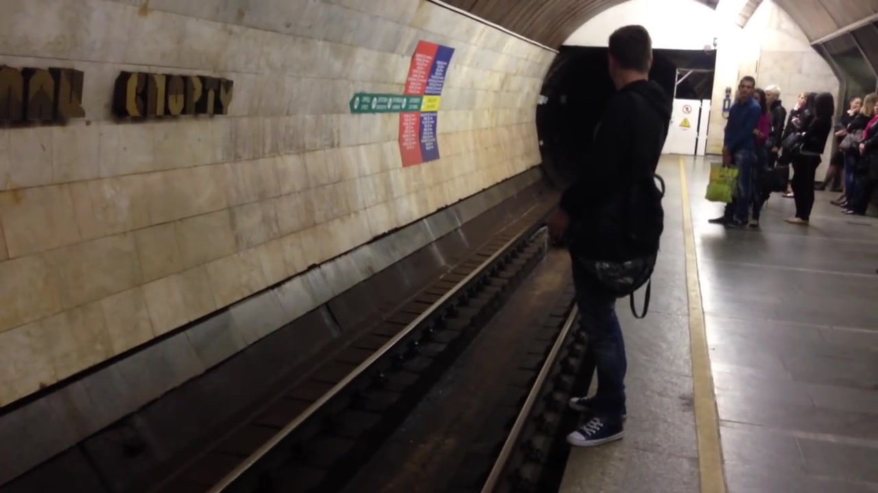 Drunk guy piss down the subway tunnel