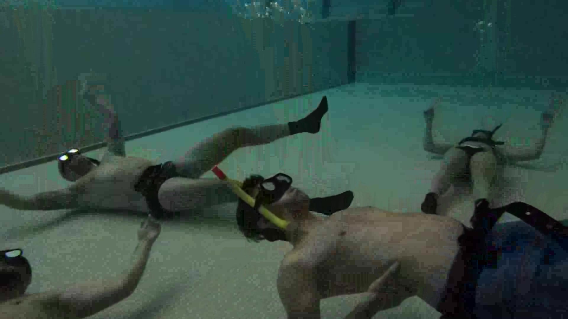 Swiss freedivers underwater in pool