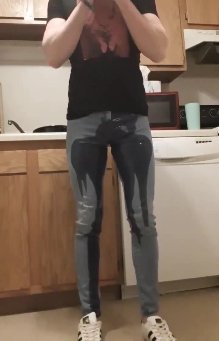 Male skinny jeans wetting in kitchen