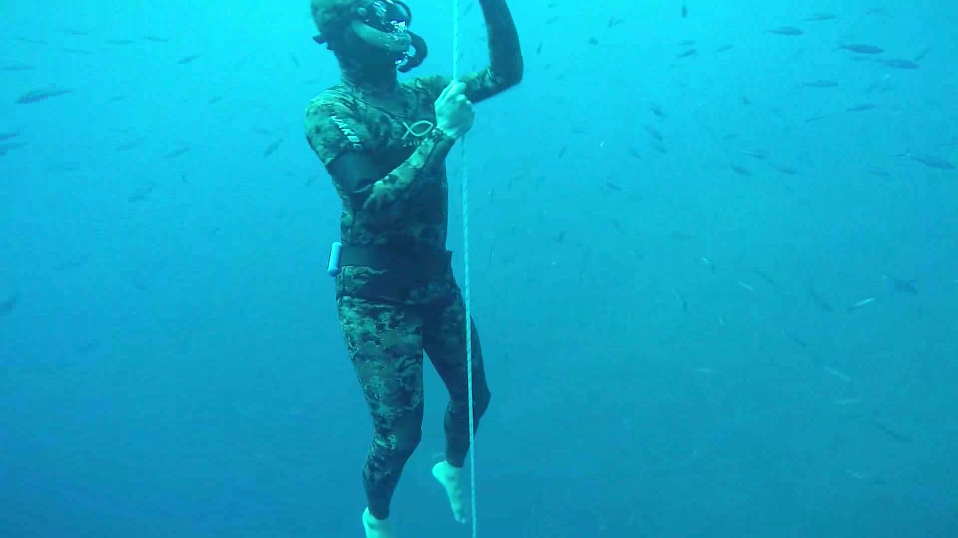 Bareffet arab freediver underwater in wetsuit