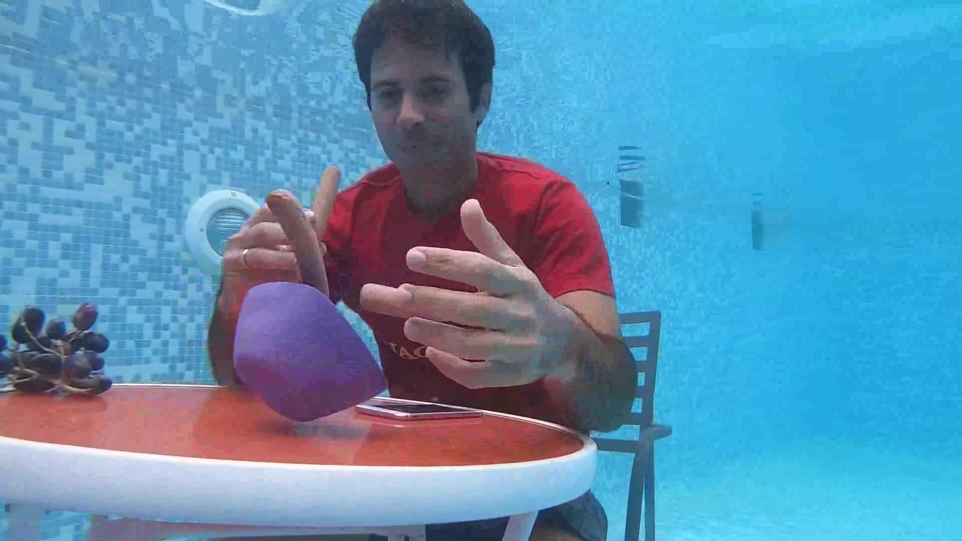 Clothed and barefaced guy living underwater