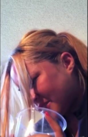 Girl pukes in cup