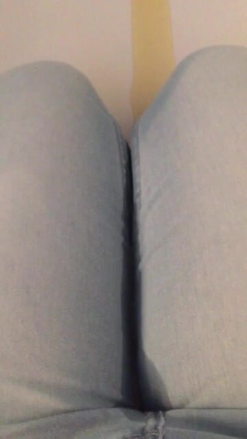 Girl pees jeans  sitting