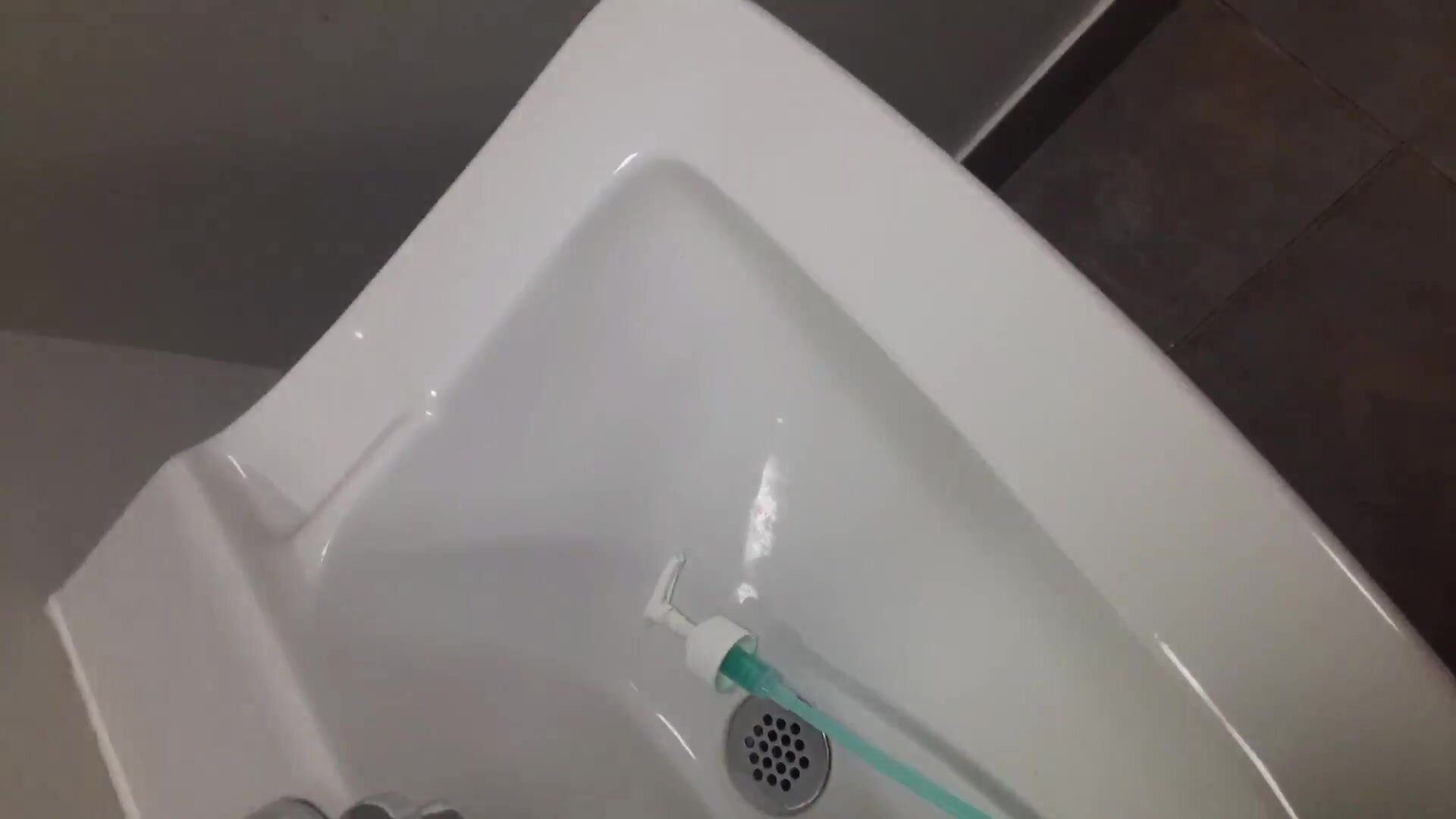 Piss public batheroom in soap dispenser
