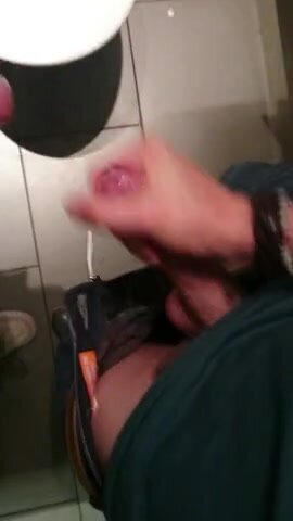 Two guys jerking in stall