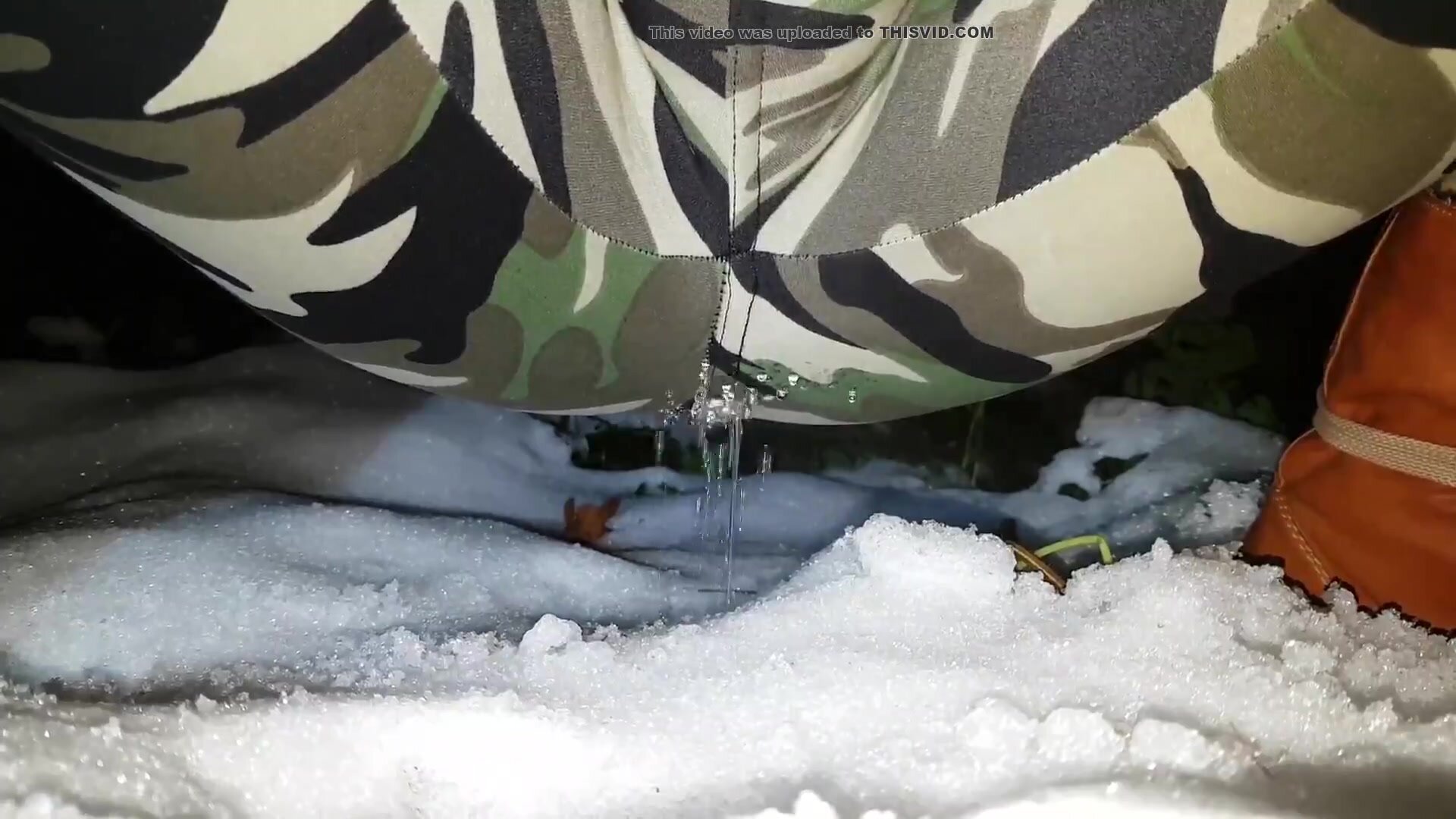 Girl pee camo trousers in snow