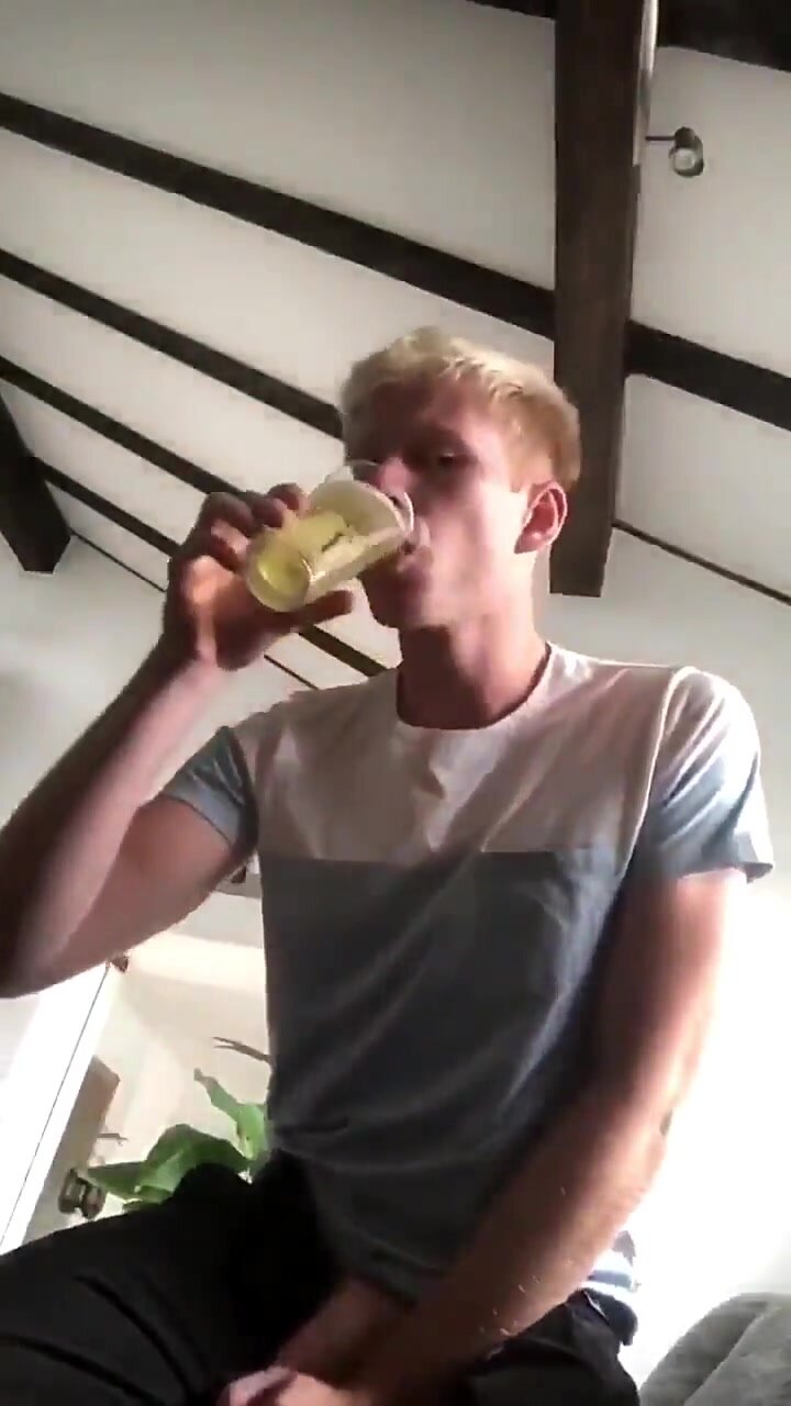 Twink pours himself a glass of piss