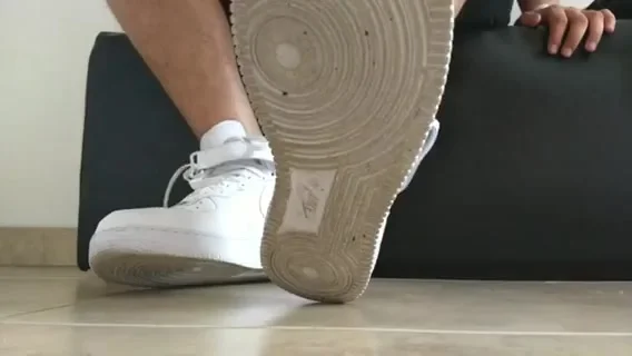 Boy feet play with Nike Air Force One - ThisVid.com
