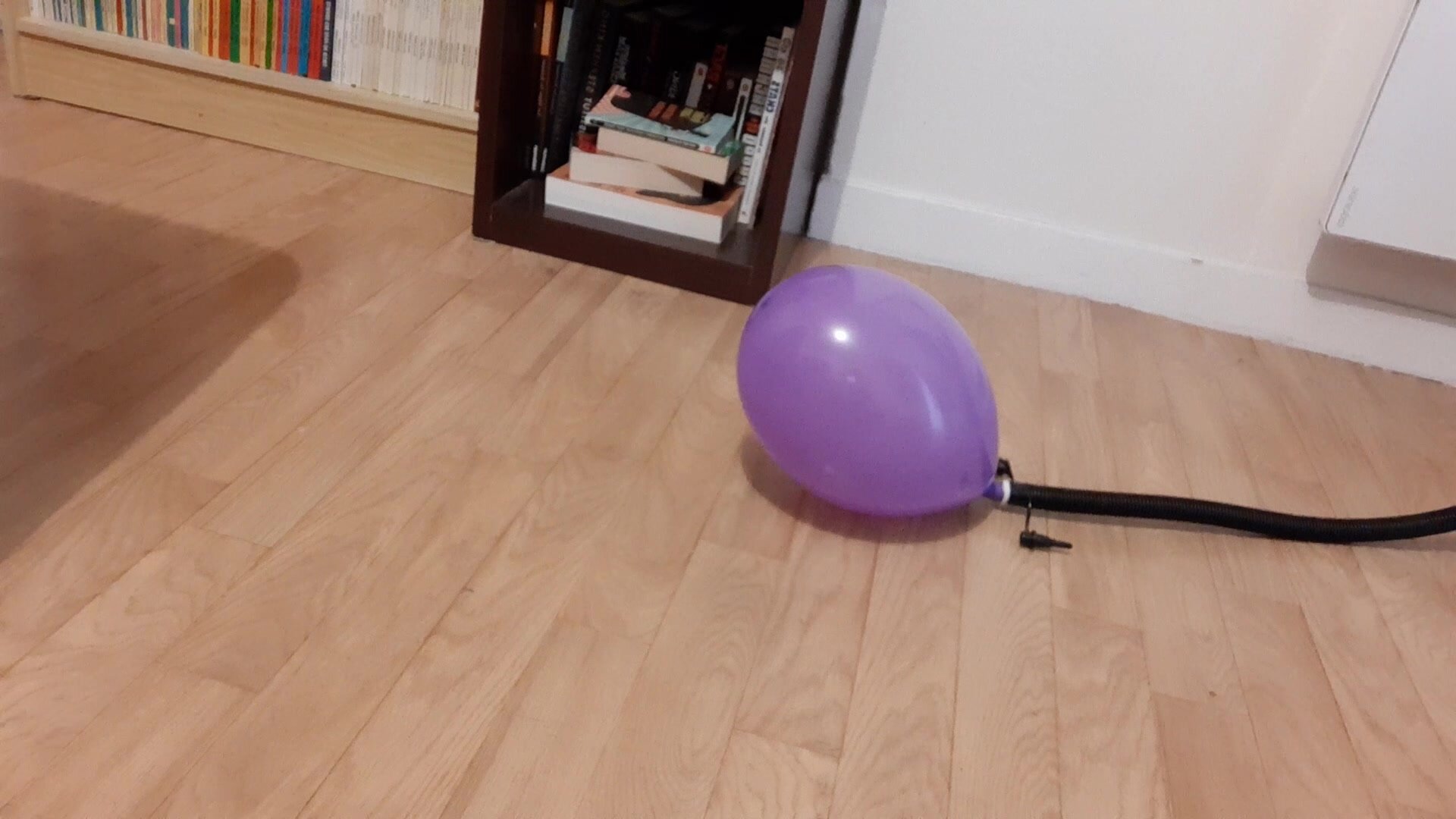 Pump to pop purple balloon