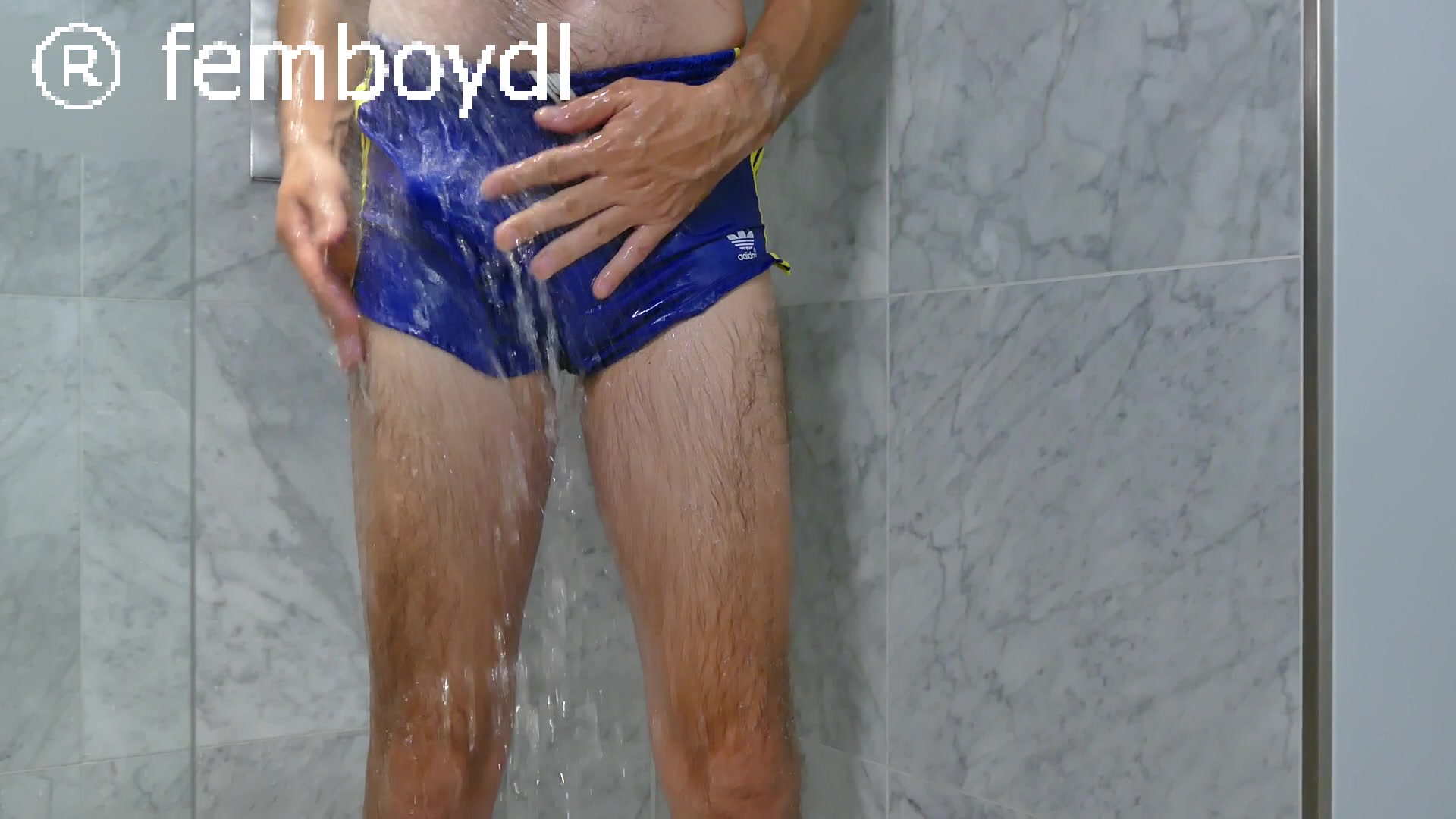 pee and jerk in shiny blue adidas nylon shorts in the shower