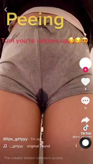 Loud pissing into her shorts