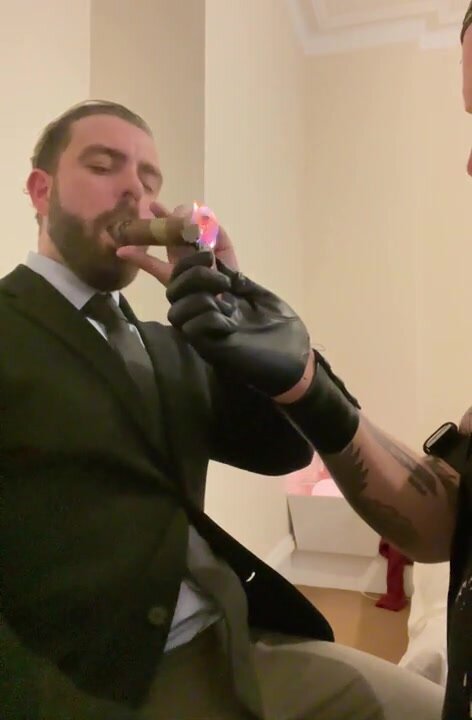 suit man smocking (no nudity)