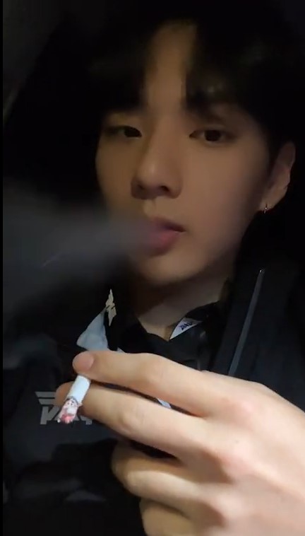 Cute Korean guy smoking in the car 2