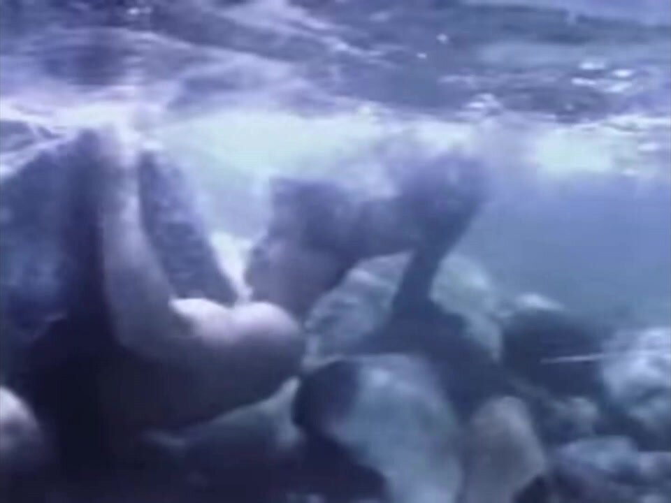Man Pinned by Rock Underwater