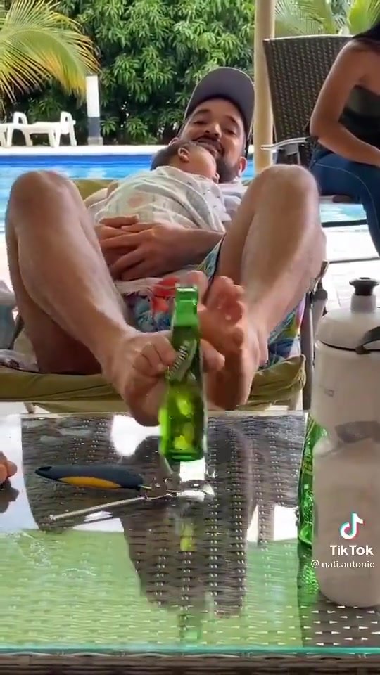 Opening a beer with feet