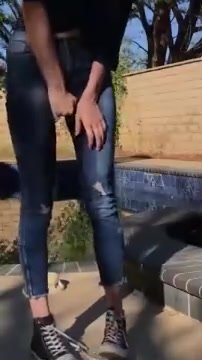 Girl PIssing Jeans outside house nice summer weather