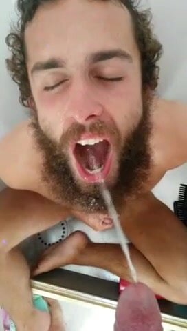 Bearded guy gets pissed in his mouth