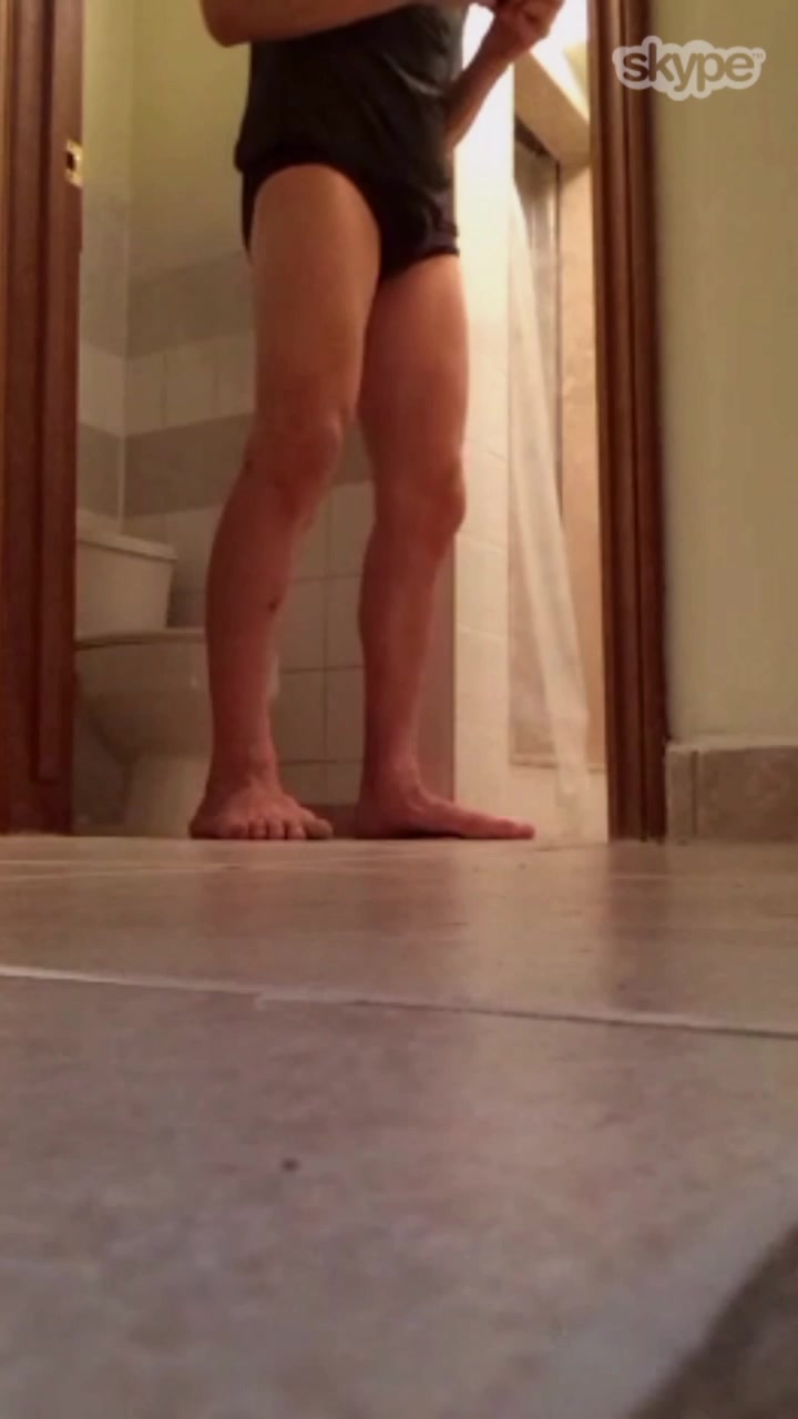 Giant sitting on small toilet