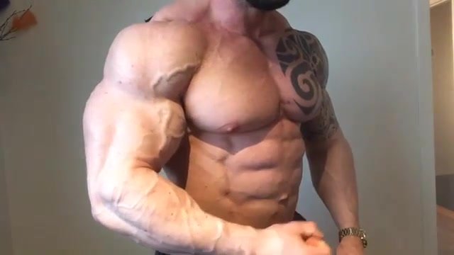 Big Bodybuilder Flexing Arms