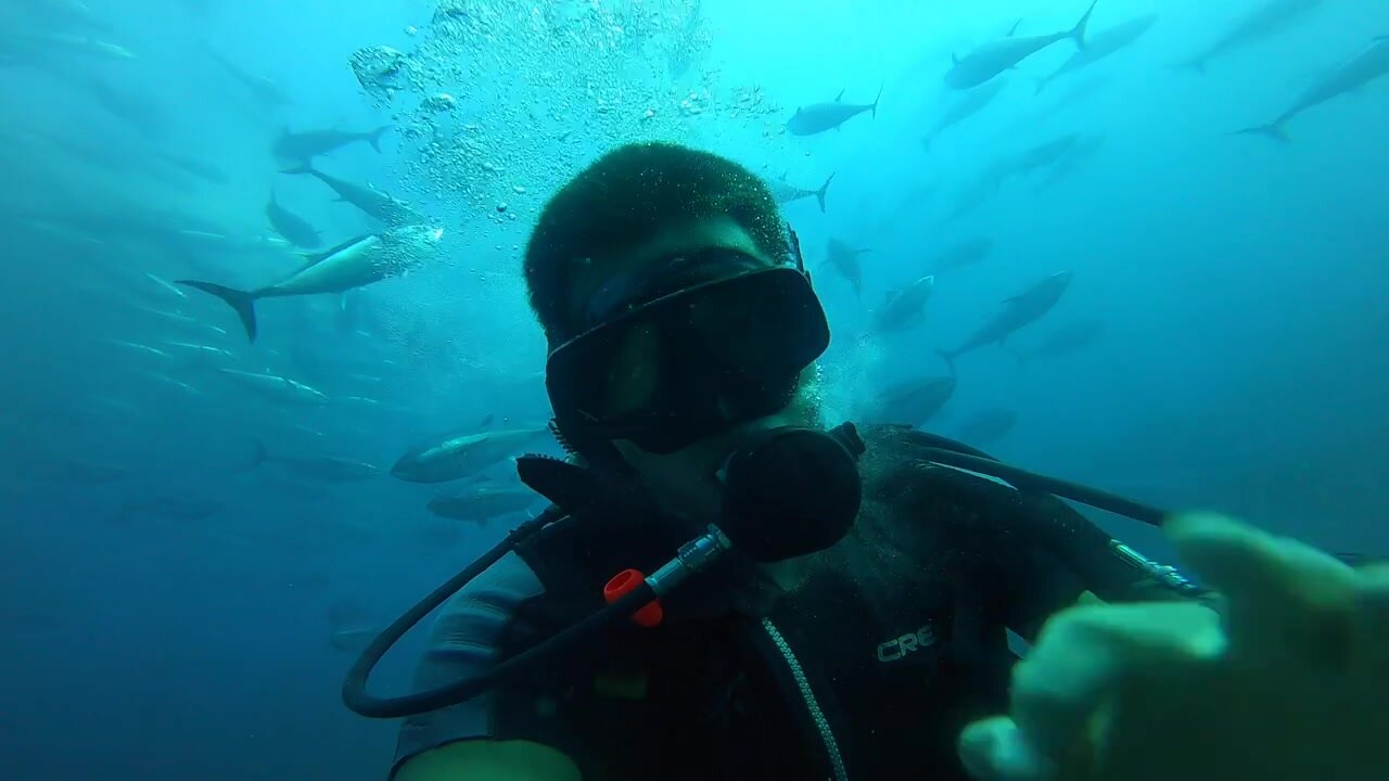Turkish scubadiver unmasking deep underwater