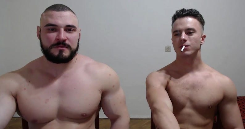 two muscle guys smoking