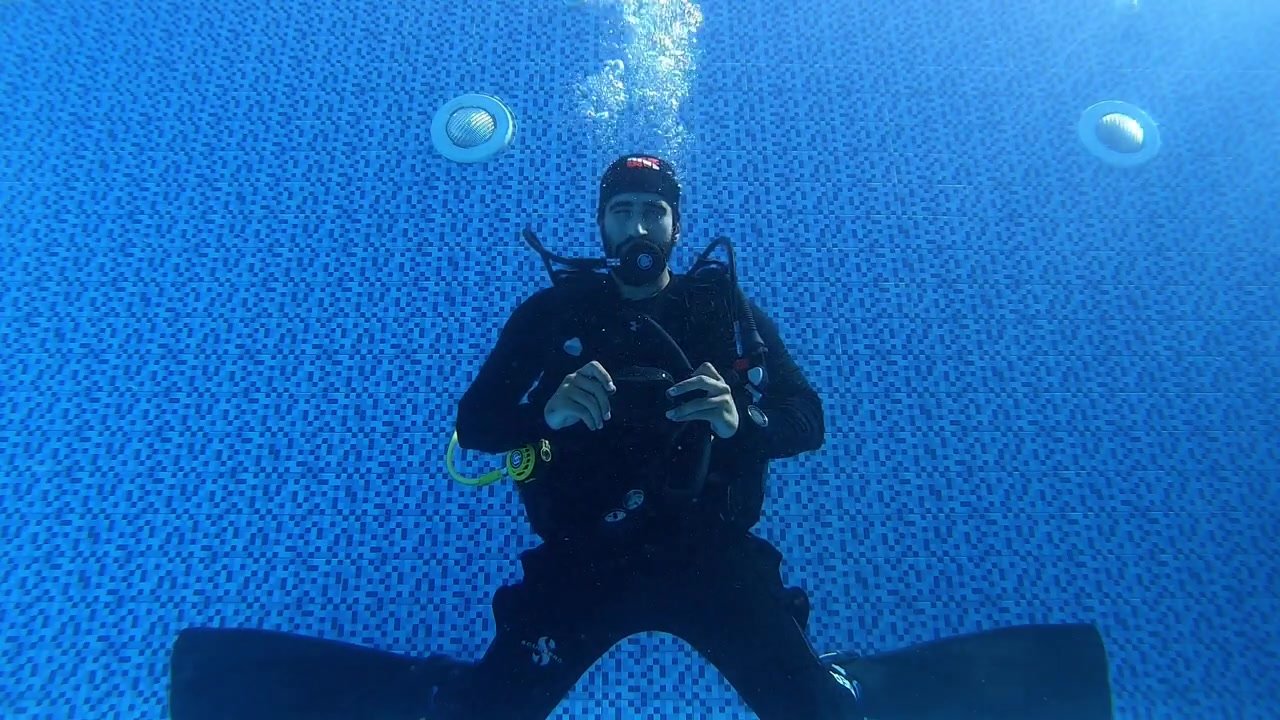 Arab scubadiver's underwater mask removal
