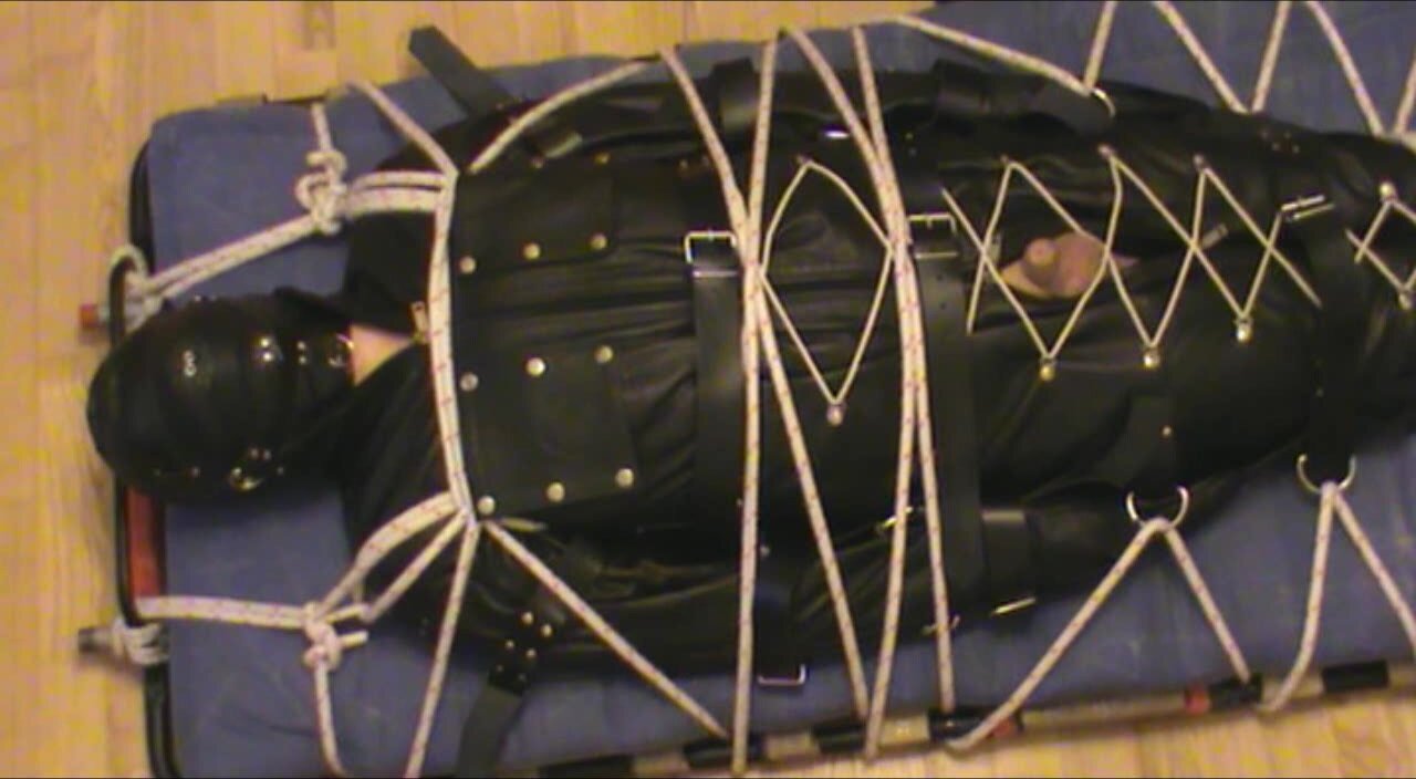 Deprivated slave is in the leather bodybag - video 2