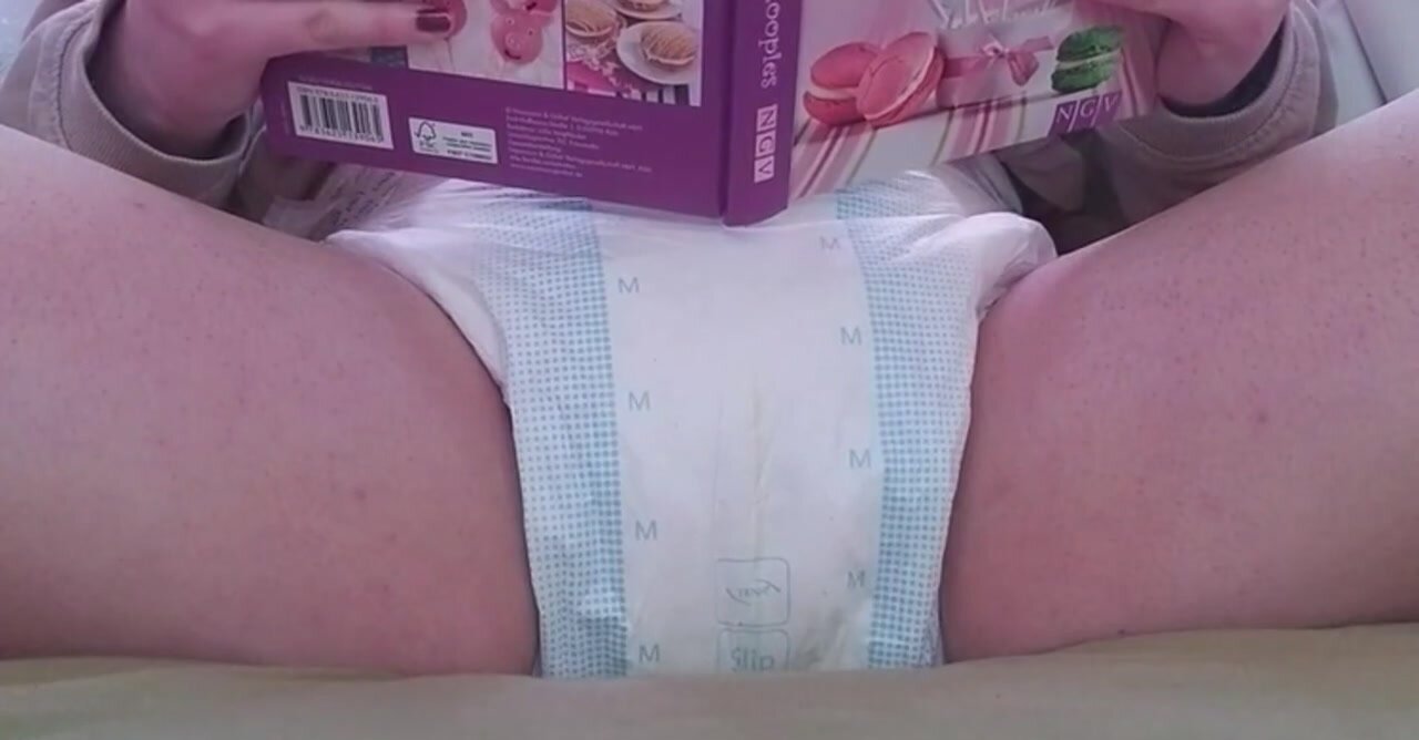 Diaper Girl Has A Big Accident While Reading Her Book