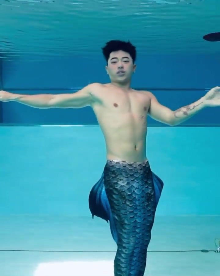 Underwater barefaced asian merman