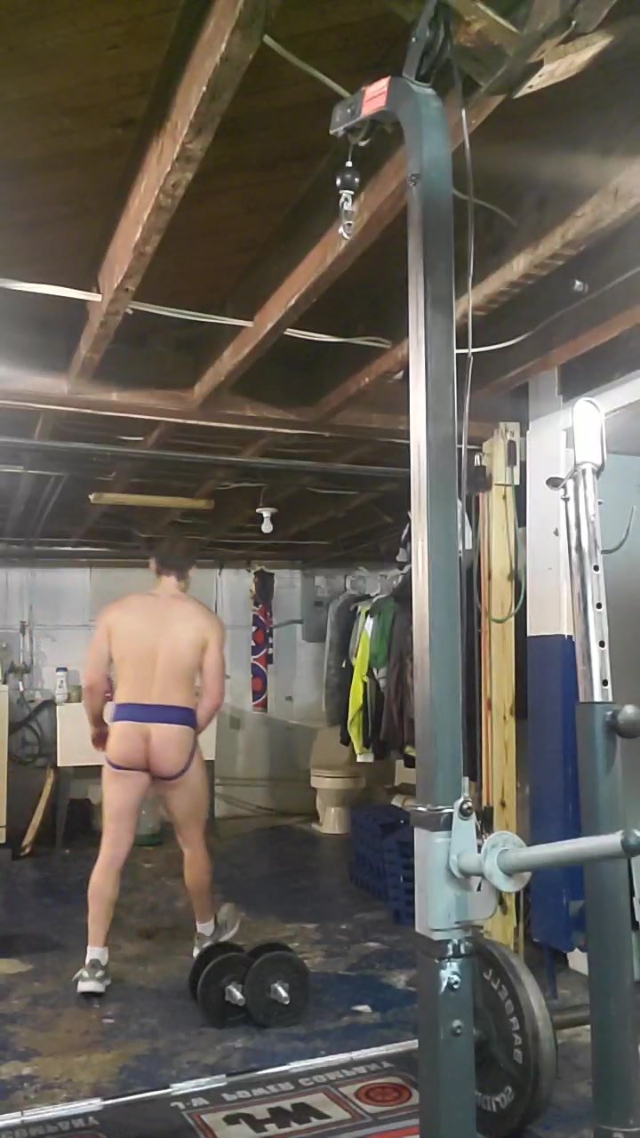 Guy works out in jockstrap
