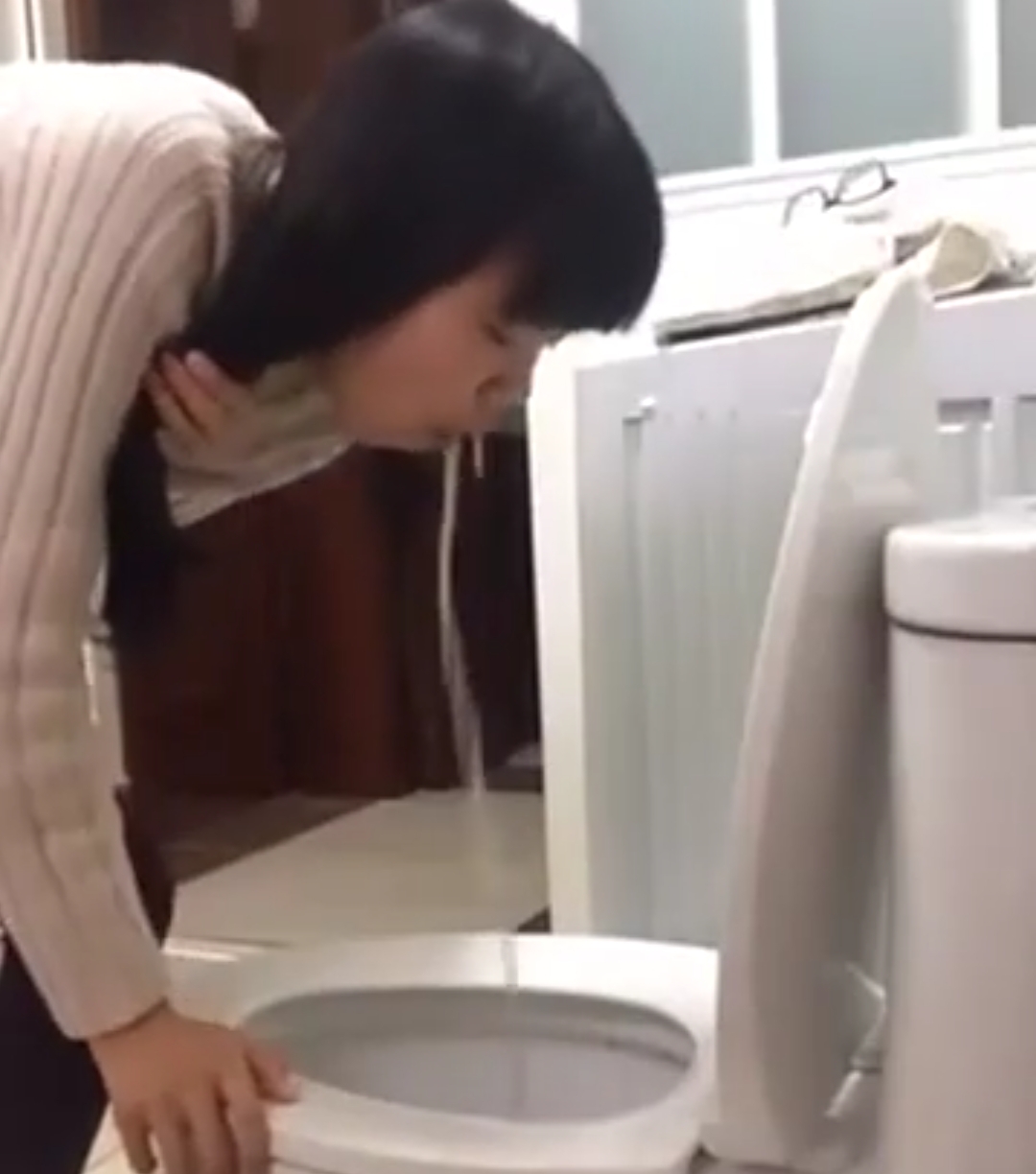 Asian girl toilet vomiting