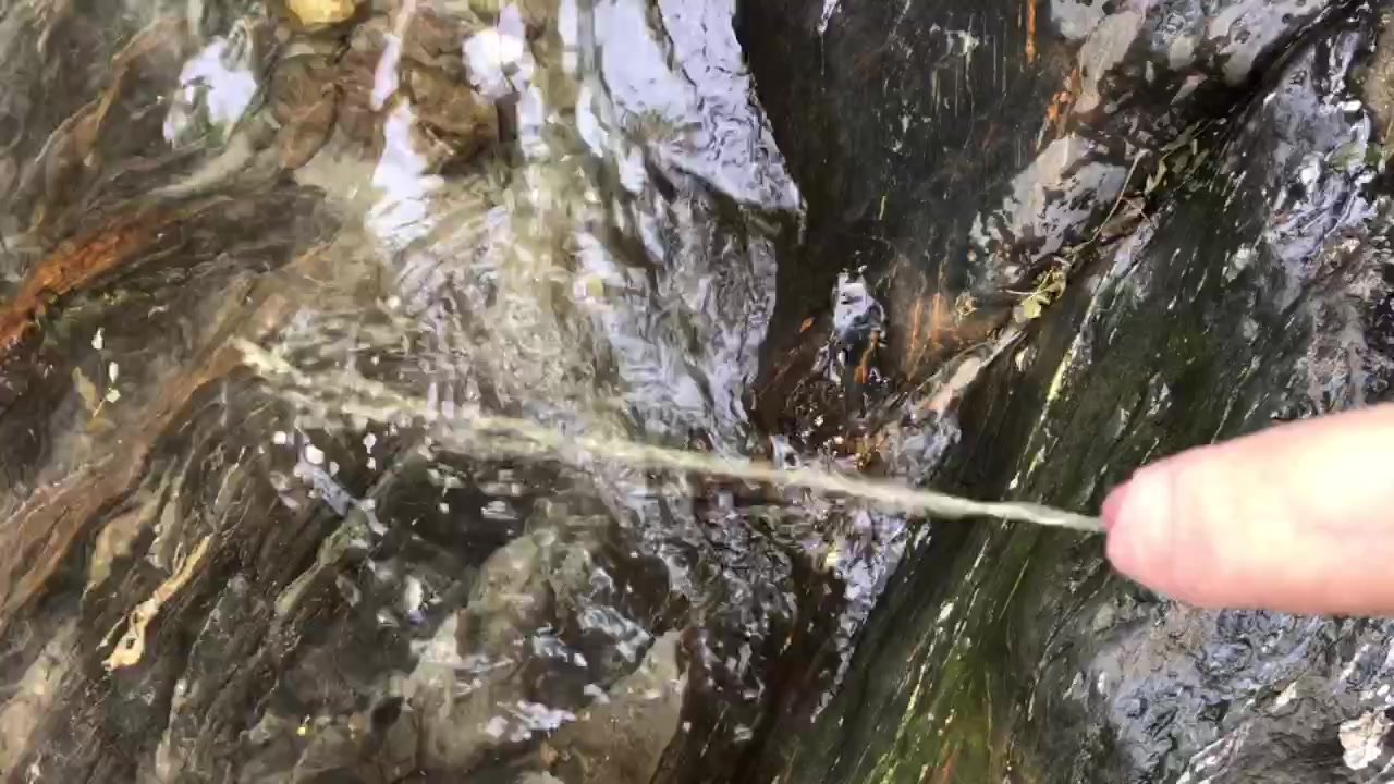 Pissing in the river - video 2