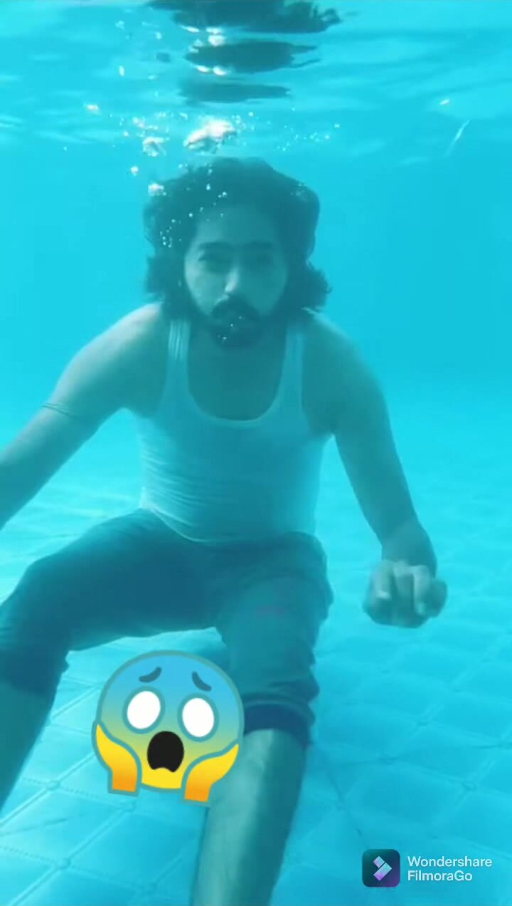 Underwater barefaced clothed indian - video 2