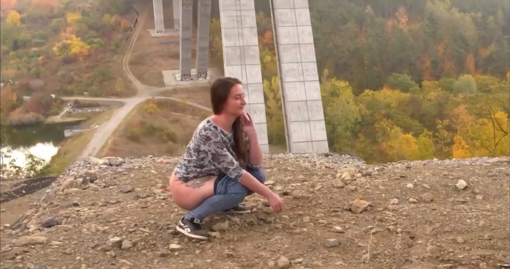Cute thick girl takes a nice piss on the mountain