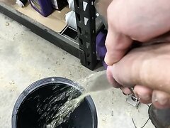 Mechanic pierced cock pissing