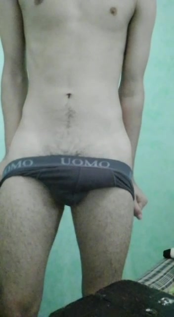 Stripping off tight undies to expose uncut teen cock