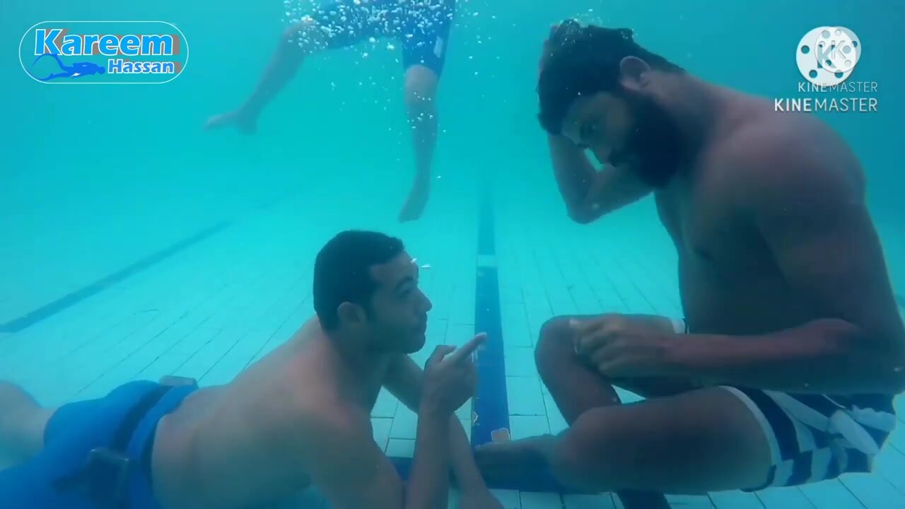 Kareem and friends talking barefaced underwater