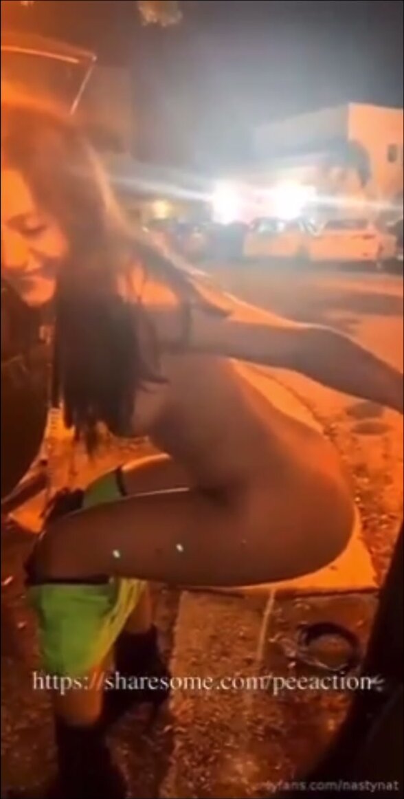 Girl piss next to car