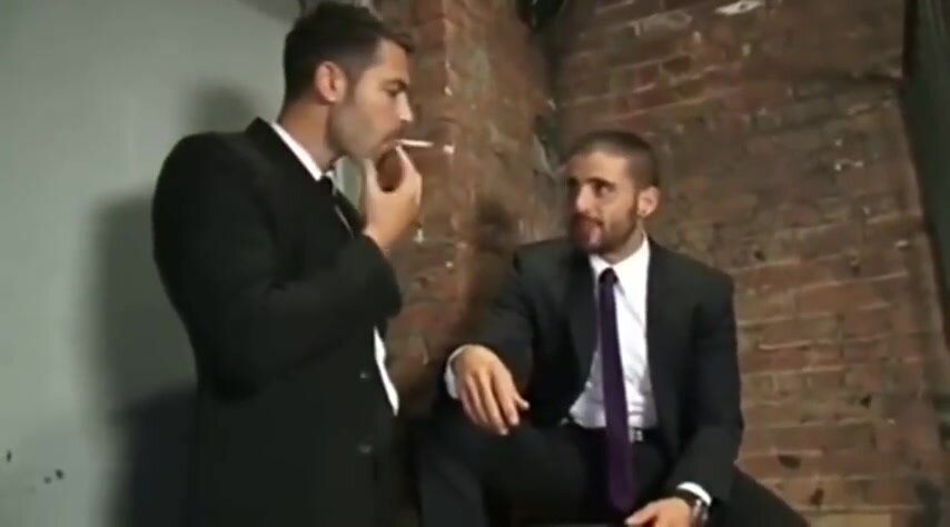 Two hot  men share a Smoke