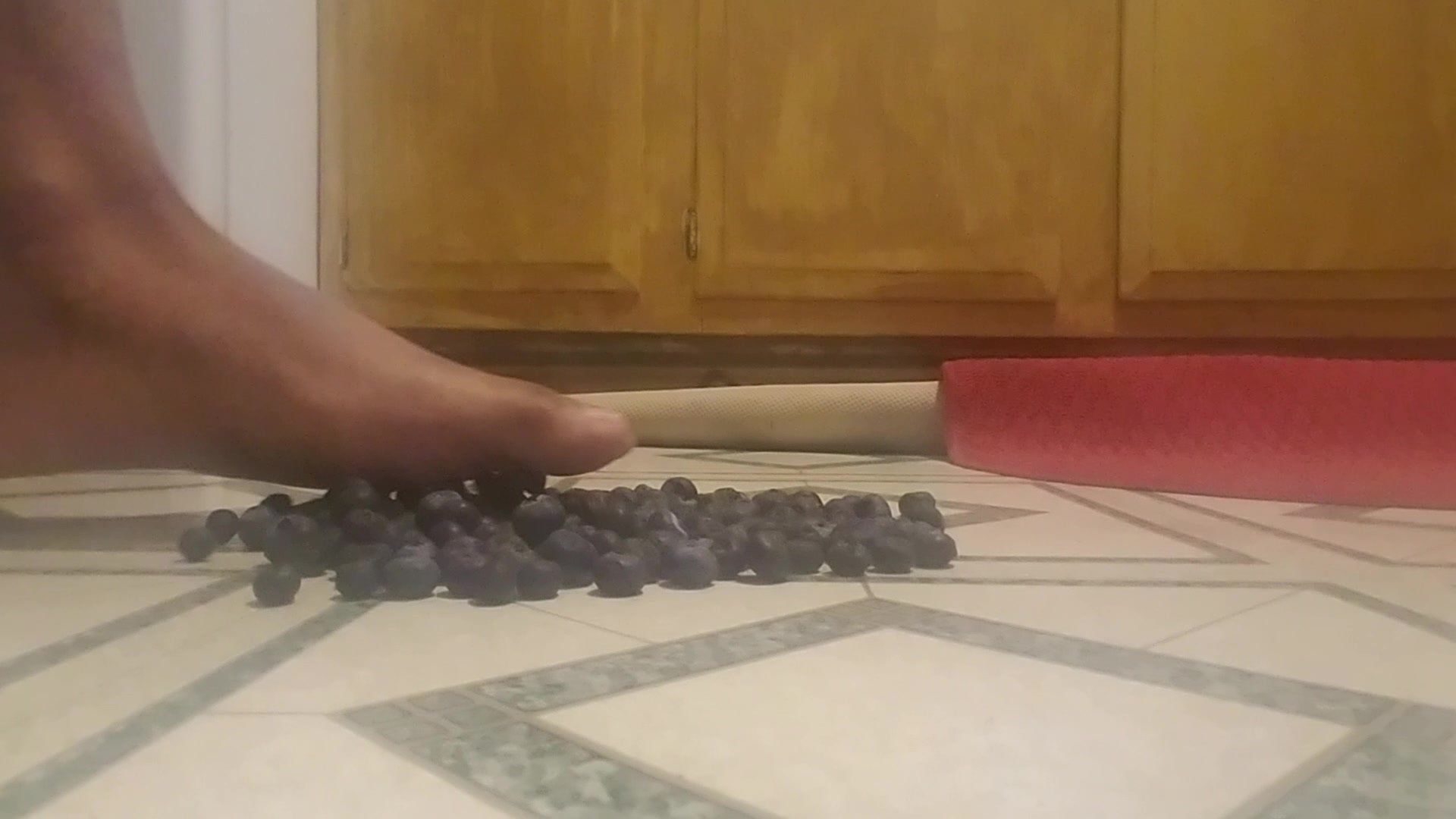 Male Feet Crush Blueberries