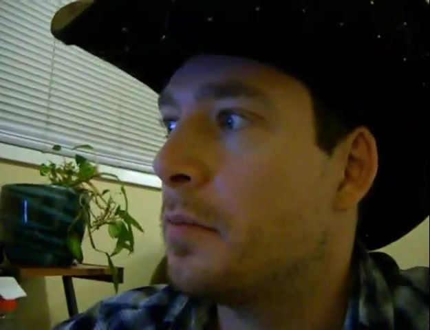 Good Looking cowboy smokes and wanks watching porn