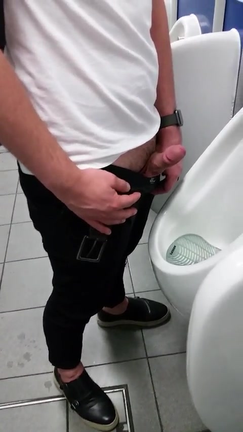 Hot guy jerking off at urinals. 