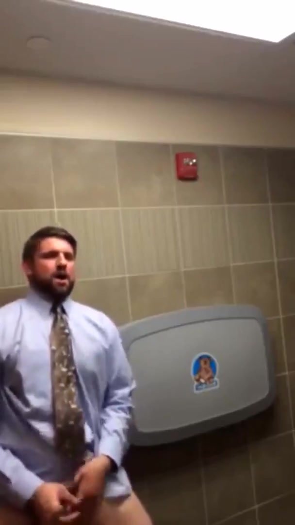Business guy horny in public bathroom