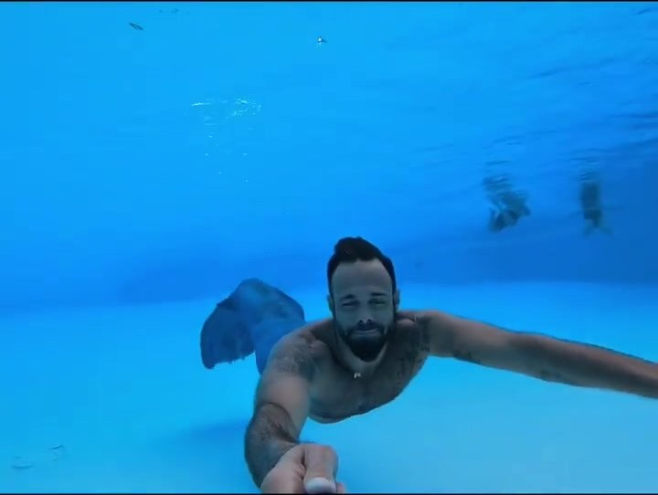 Bearded barefaced merman underwater in pool - video 2