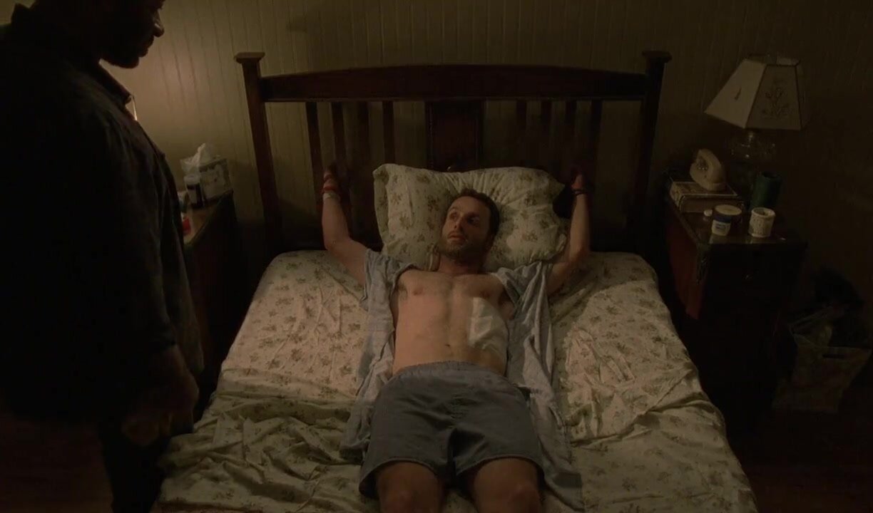 Andrew Lincoln tied to the bed