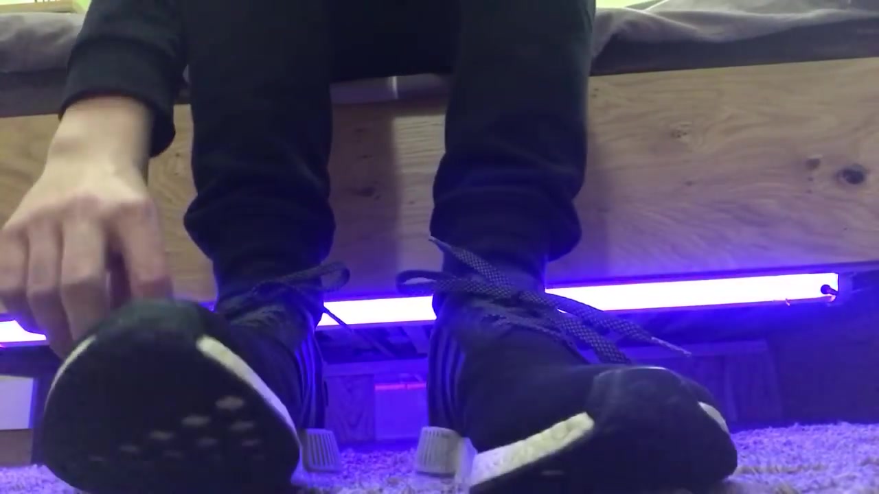 Teen showing off Adidas NMD